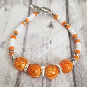 Orange & white glass beaded bracelet